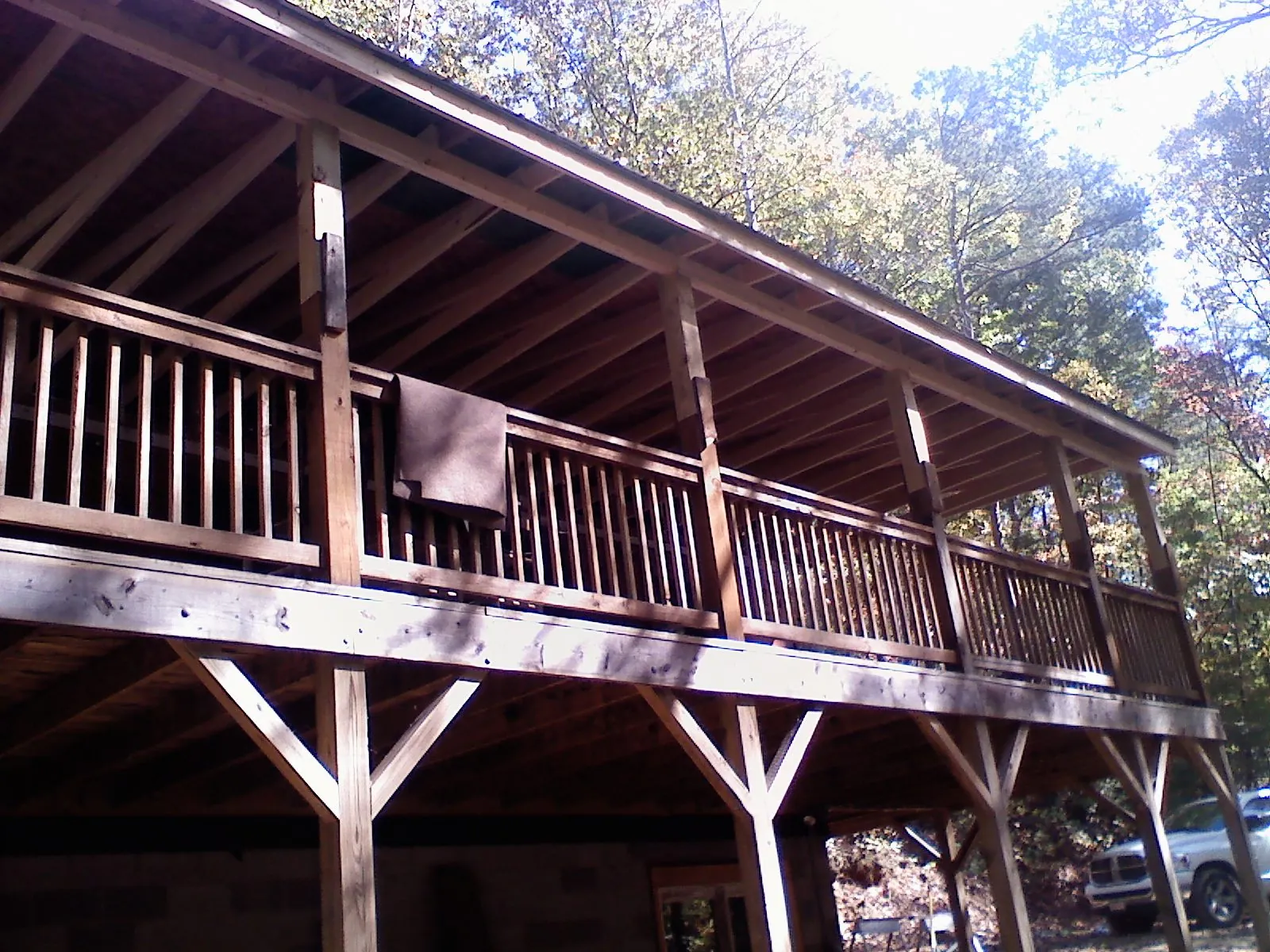 Timber framing under a new elevated porch and deck — Roof Leak Repair in Yukon by Roofing Brothers